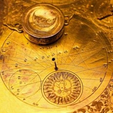 Old clock with zodiac elements and golden